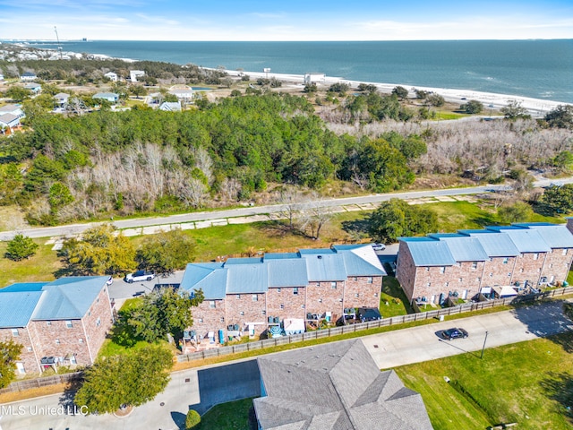 drone / aerial view with a water view and a residential view