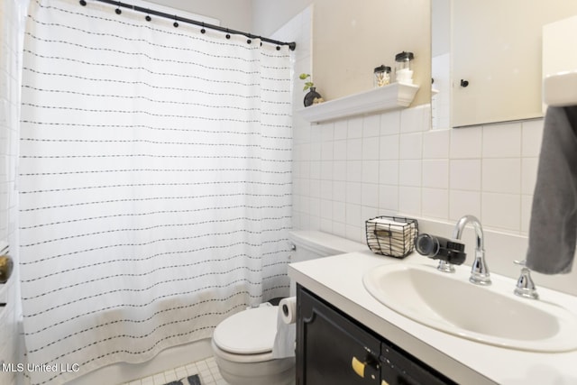 bathroom with backsplash, tile patterned floors, vanity, tile walls, and toilet