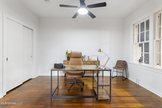 office space featuring dark hardwood / wood-style floors and ceiling fan