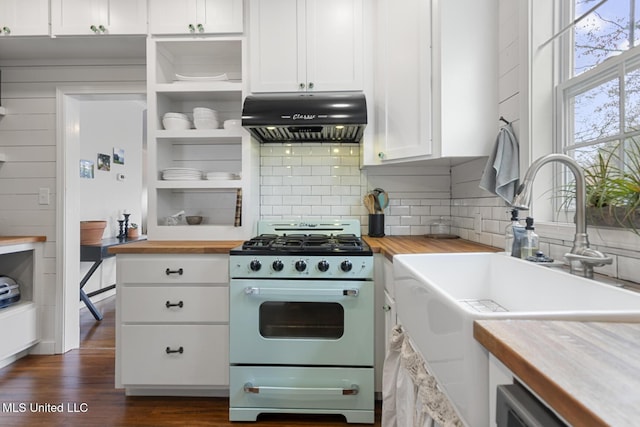 kitchen featuring ventilation hood, white cabinets, wooden counters, and white gas range oven