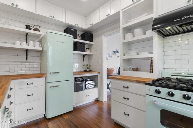 kitchen featuring custom exhaust hood, white appliances, backsplash, white cabinets, and butcher block counters