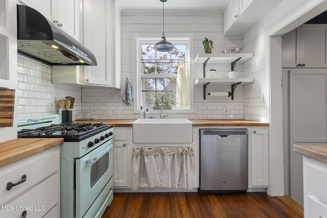 kitchen with dishwasher, wooden counters, white cabinets, hanging light fixtures, and gas stove