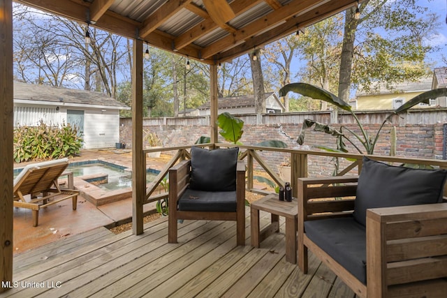 wooden deck featuring a jacuzzi