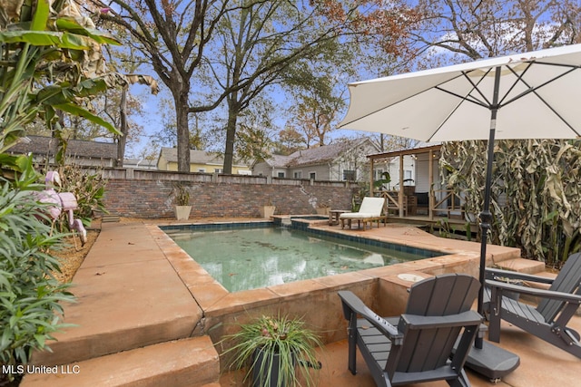 view of pool featuring a deck