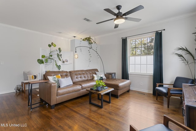 living room featuring ceiling fan, dark hardwood / wood-style flooring, and crown molding