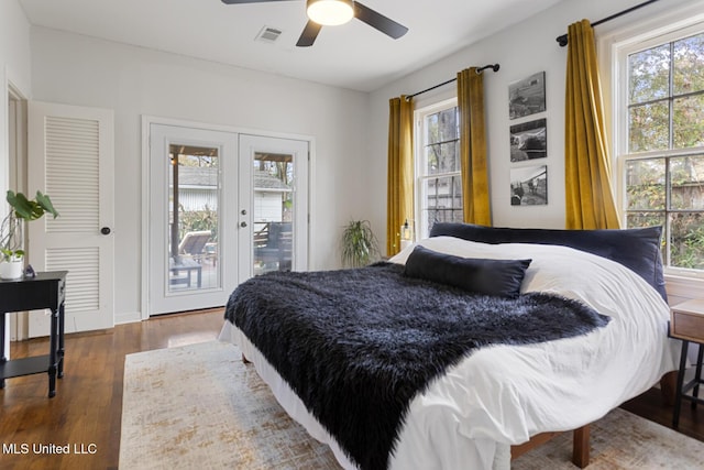 bedroom featuring french doors, access to outside, ceiling fan, and dark hardwood / wood-style floors