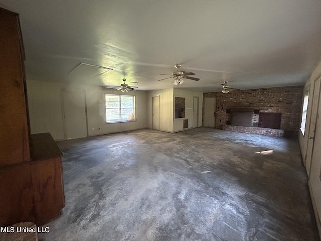 unfurnished living room with ceiling fan