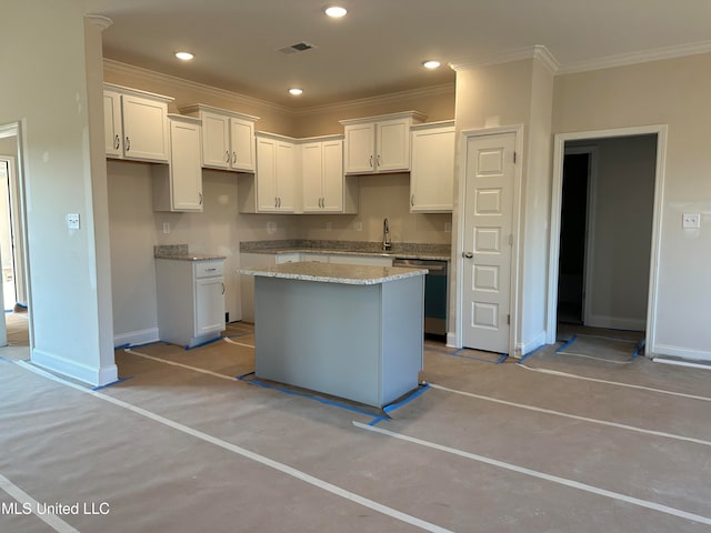 kitchen featuring dishwasher, white cabinets, and a center island