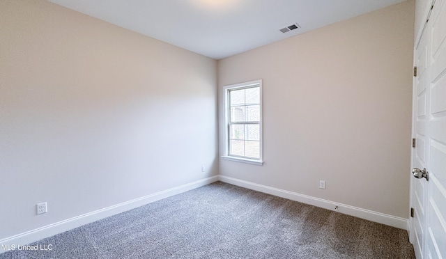 empty room with carpet flooring