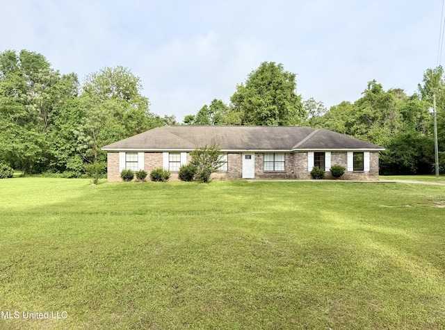 ranch-style home with a front lawn and brick siding