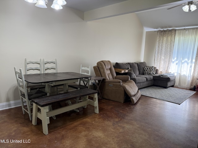 living room featuring concrete flooring, a chandelier, and ceiling fan