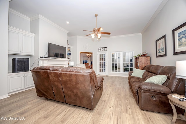 living area with a ceiling fan, light wood finished floors, and ornamental molding