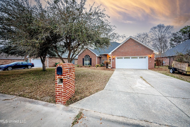 view of front of house with brick siding, concrete driveway, and an attached garage