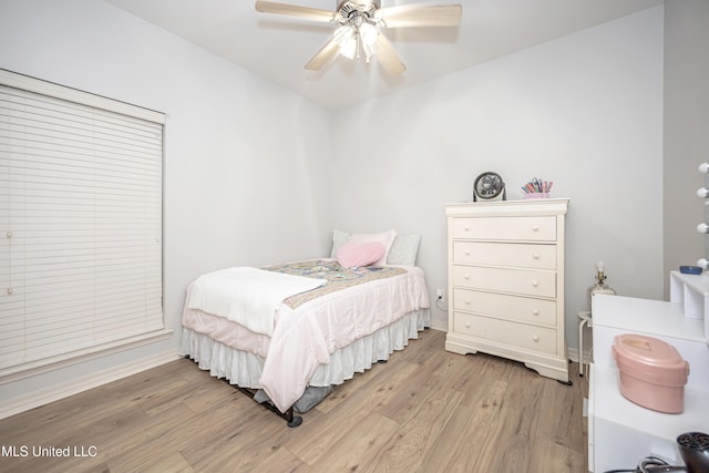 bedroom featuring light wood-style floors and ceiling fan