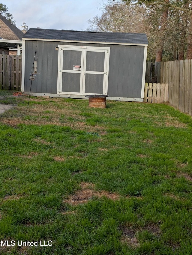 view of shed with fence