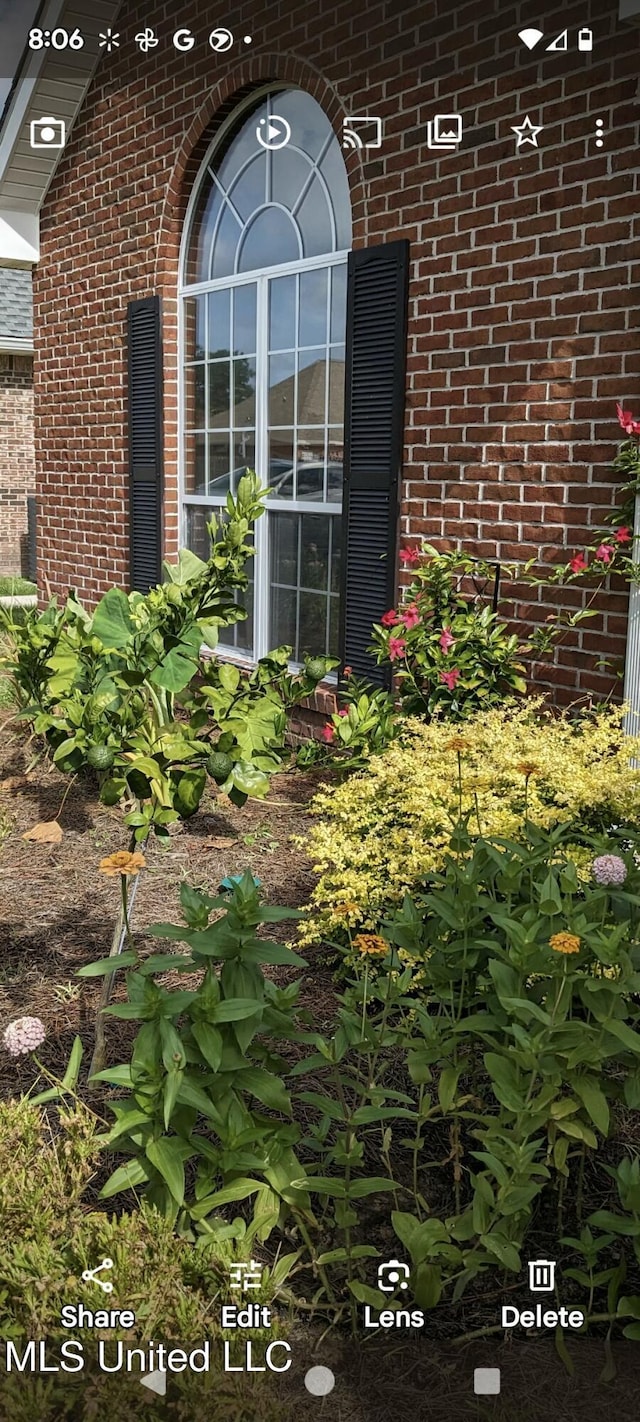 exterior details featuring brick siding