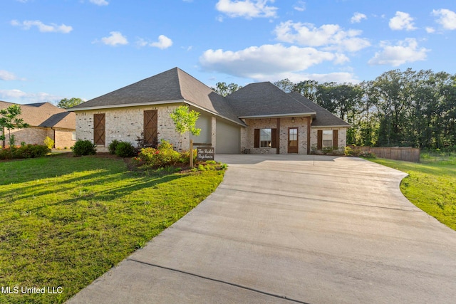 112 Richburg Ct, Pearl, MS 39208 - french country home with concrete driveway, brick siding, a garage, and a shingled roof