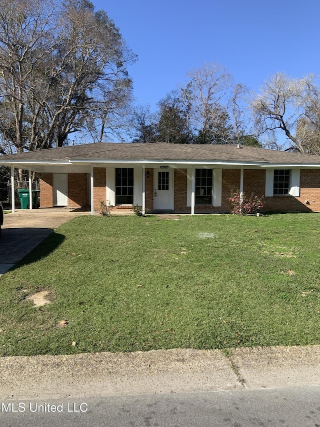 single story home featuring a carport and a front yard