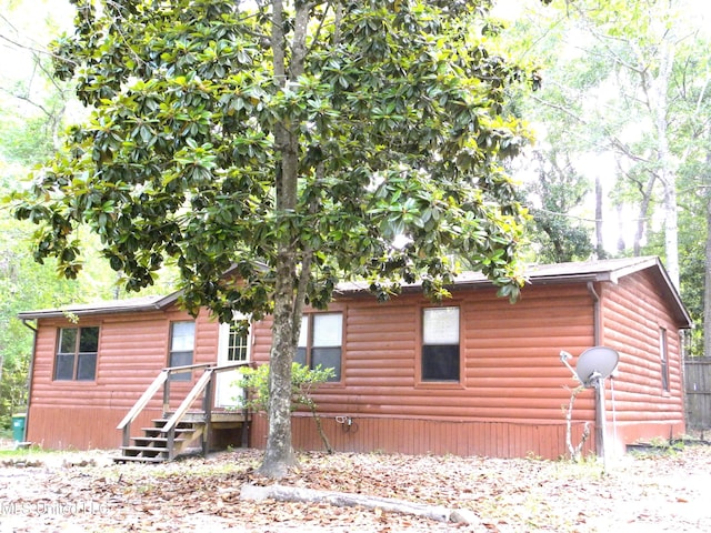 view of front of property featuring log veneer siding