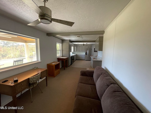 carpeted living room featuring ornamental molding, a textured ceiling, and ceiling fan