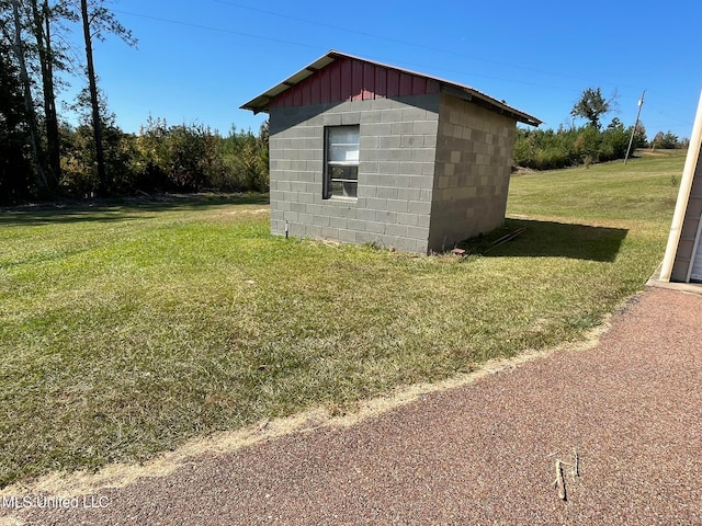 view of outbuilding with a lawn