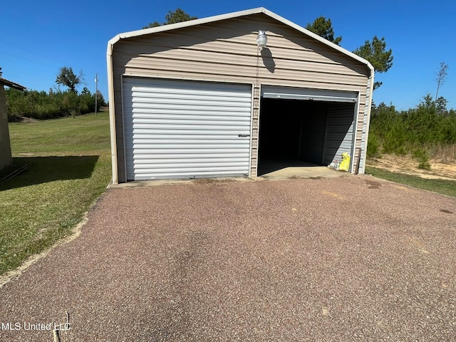 garage with a yard