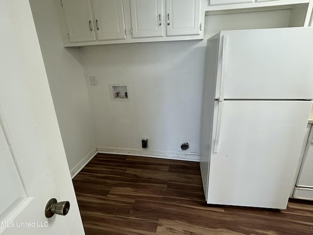 laundry area featuring baseboards, dark wood finished floors, washer hookup, cabinet space, and hookup for an electric dryer