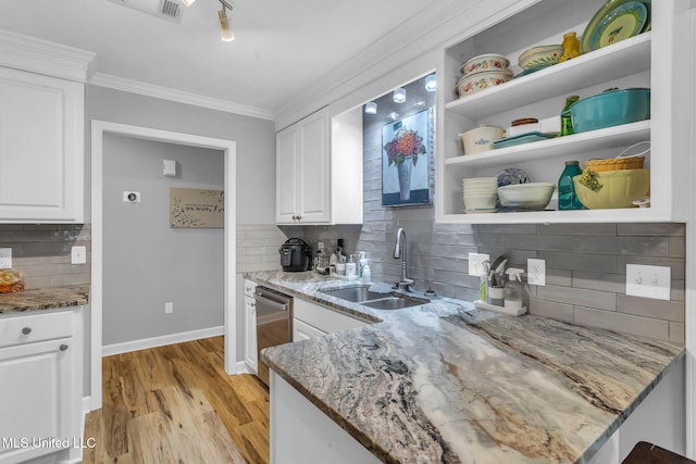 3007 Cross Point Cv, Brandon, MS 39042 - kitchen with tasteful backsplash, white cabinetry, crown molding, light stone countertops, and light wood-style floors