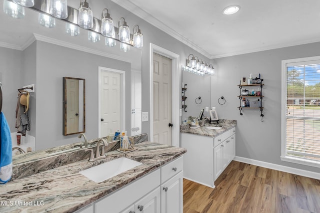3007 Cross Point Cv, Brandon, MS 39042 - bathroom with wood finished floors, two vanities, crown molding, and recessed lighting