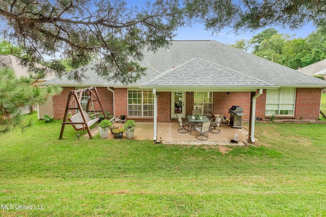 3007 Cross Point Cv, Brandon, MS 39042 - rear view of property featuring a shingled roof and a lawn