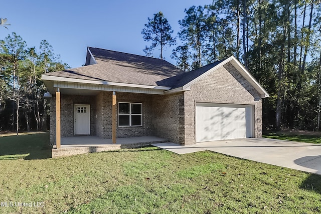 single story home featuring a front lawn, covered porch, and a garage