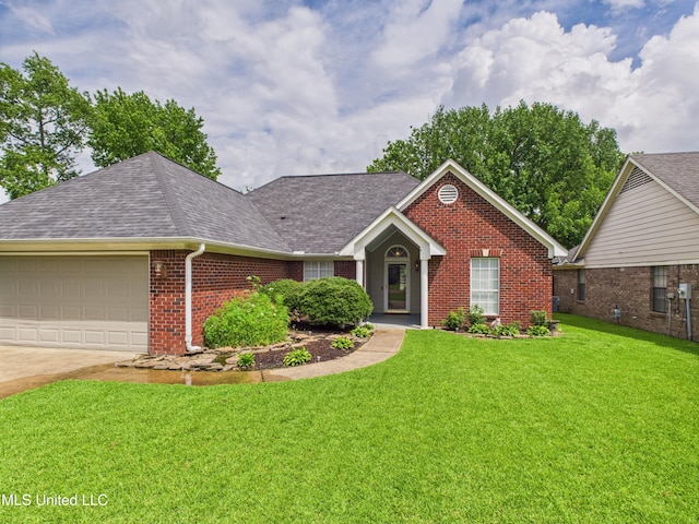 5710 Southbend Ln, Olive Branch, MS 38654 - view of front of home featuring brick siding, a front lawn, an attached garage, roof with shingles, and concrete driveway