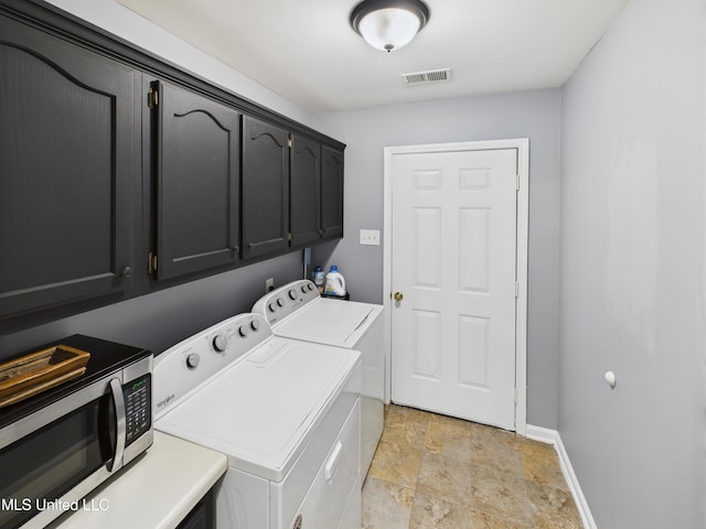 5710 Southbend Ln, Olive Branch, MS 38654 - washroom with washer and clothes dryer, cabinet space, and stone finish floors