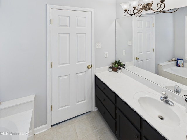 5710 Southbend Ln, Olive Branch, MS 38654 - bathroom with a garden tub, a chandelier, vanity, and tile patterned floors