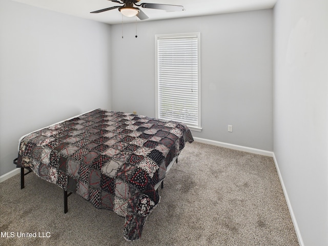 5710 Southbend Ln, Olive Branch, MS 38654 - carpeted bedroom featuring baseboards and ceiling fan