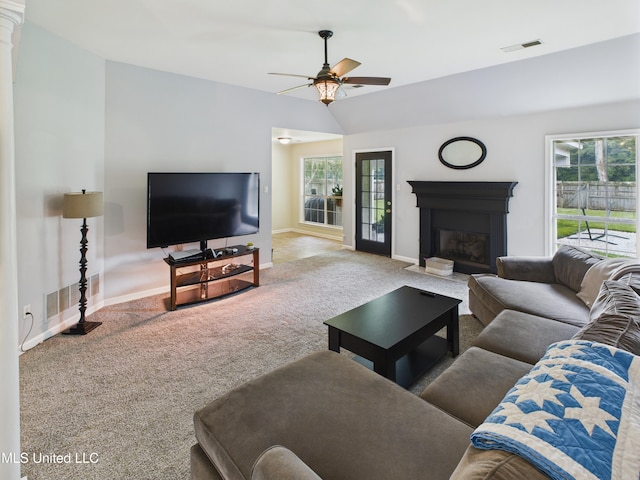 5710 Southbend Ln, Olive Branch, MS 38654 - living room featuring carpet, a ceiling fan, healthy amount of natural light, a fireplace with flush hearth, and vaulted ceiling