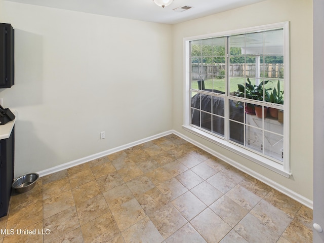 5710 Southbend Ln, Olive Branch, MS 38654 - spare room featuring baseboards and stone finish flooring