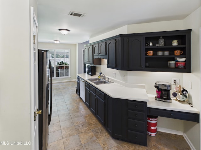 5710 Southbend Ln, Olive Branch, MS 38654 - kitchen featuring stainless steel appliances, light countertops, light stone finish flooring, and open shelves