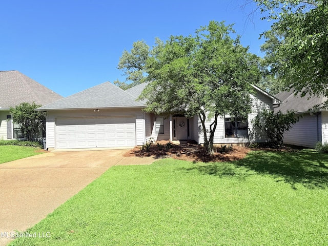 414 Spike Rdg, Canton, MS 39046 - obstructed view of property with an attached garage, a front yard, concrete driveway, and roof with shingles