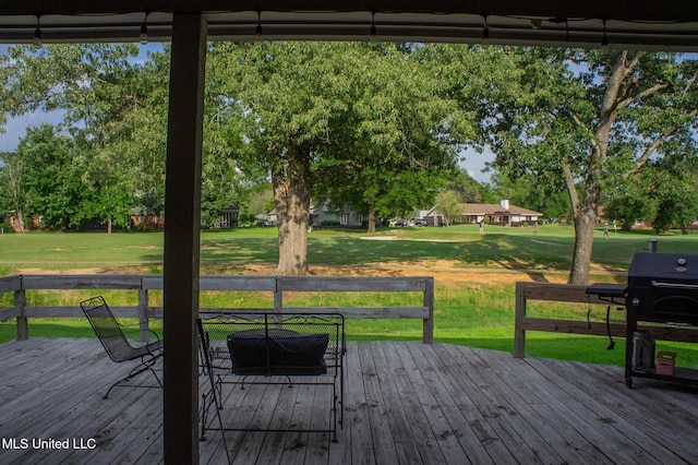 414 Spike Rdg, Canton, MS 39046 - wooden terrace with a lawn, view of wooded area, and grilling area