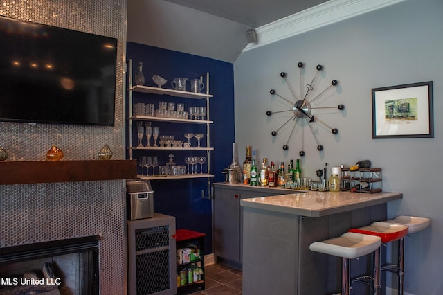 414 Spike Rdg, Canton, MS 39046 - indoor dry bar with tile patterned flooring, lofted ceiling, and baseboards