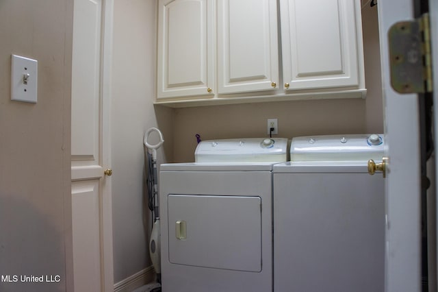 414 Spike Rdg, Canton, MS 39046 - laundry room featuring washing machine and clothes dryer and cabinet space