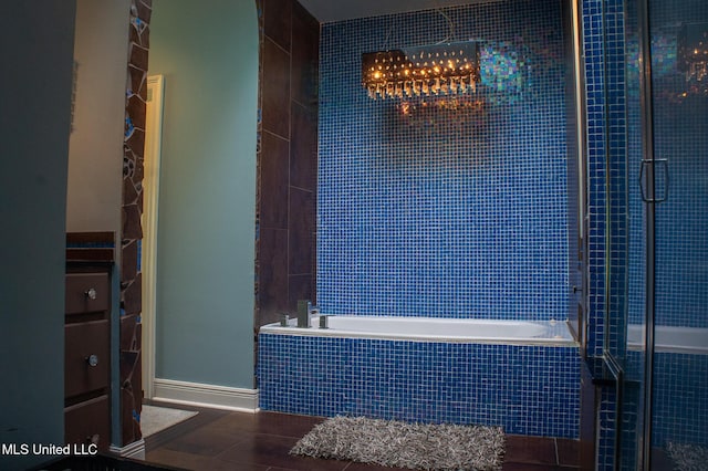 414 Spike Rdg, Canton, MS 39046 - full bath with tiled tub, tiled shower, and tile patterned floors