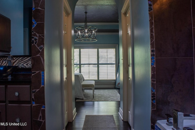414 Spike Rdg, Canton, MS 39046 - hallway with a chandelier and wood finished floors