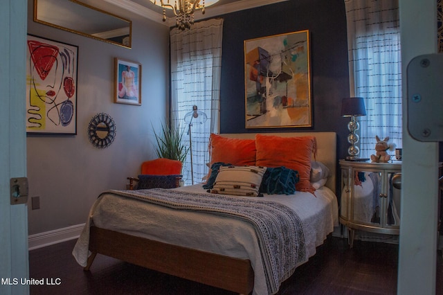 414 Spike Rdg, Canton, MS 39046 - bedroom with crown molding, wood finished floors, baseboards, and a chandelier