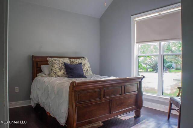 414 Spike Rdg, Canton, MS 39046 - bedroom with vaulted ceiling, baseboards, and wood finished floors