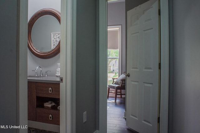 414 Spike Rdg, Canton, MS 39046 - hall featuring a sink, baseboards, and dark wood-type flooring