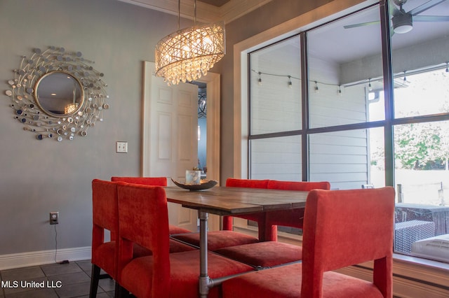 414 Spike Rdg, Canton, MS 39046 - dining room featuring baseboards, a chandelier, tile patterned floors, healthy amount of natural light, and crown molding