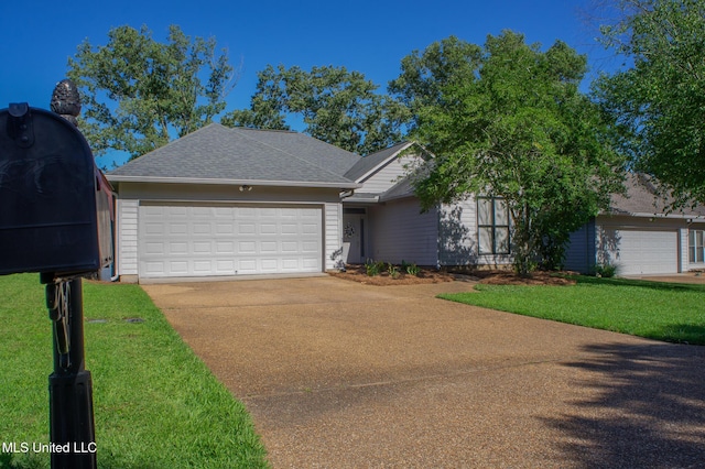 414 Spike Rdg, Canton, MS 39046 - view of front of house with concrete driveway, a garage, a front yard, and a shingled roof