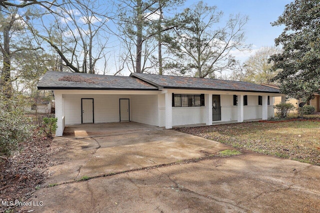 garage featuring a carport